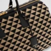 大きなPrada Symboleが刺繍されたファブリック製トラベルバッグ