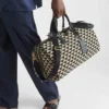 大きなPrada Symboleが刺繍されたファブリック製トラベルバッグ